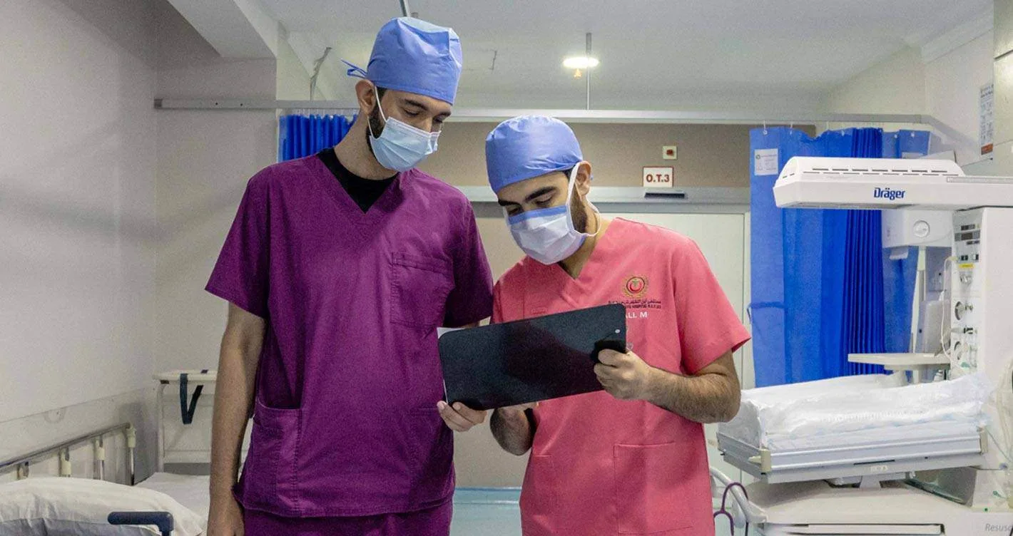 Clinicians reviewing a patient's treatment plan